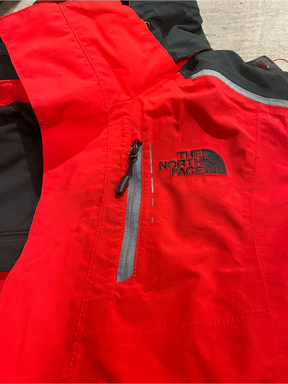 The North Face Red and Black Hooded Outdoor Jacket